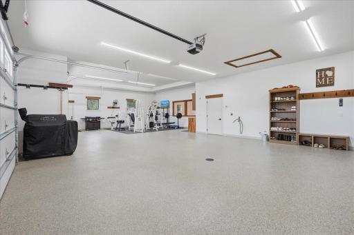 Attached garage is heated and insulated with floor drain and attic storage.