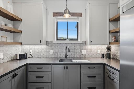 Butlers pantry with sink and ample storage!