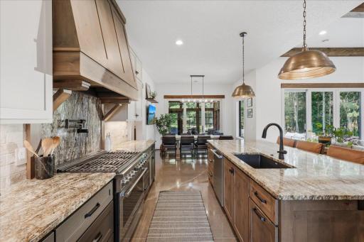 Kitchen and dining area flow seamlessly together for effortless serving and entertaining.