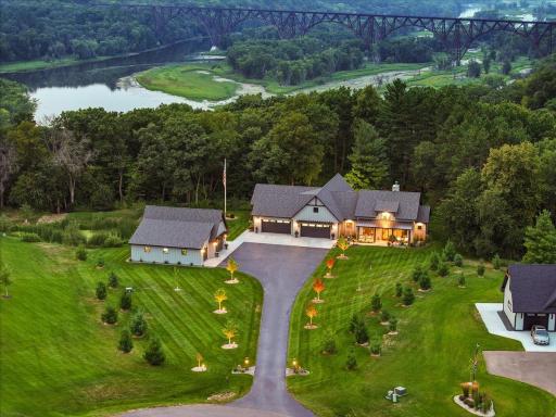 Set on 3.89 private acres, with glimpses of the St. Croix River and High Bridge through the pines