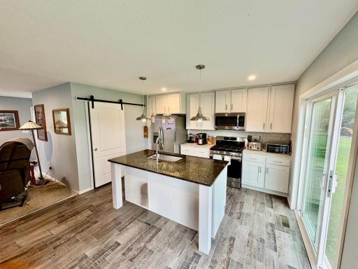 Kitchen with stainless appliances and pantry