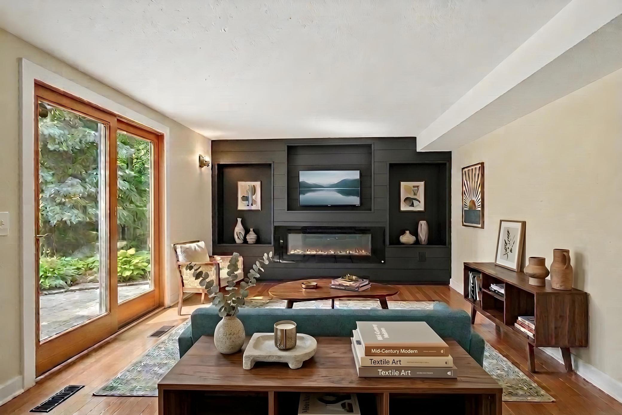 The walk-out lower level family room has a new fireplace and built-in shelving.