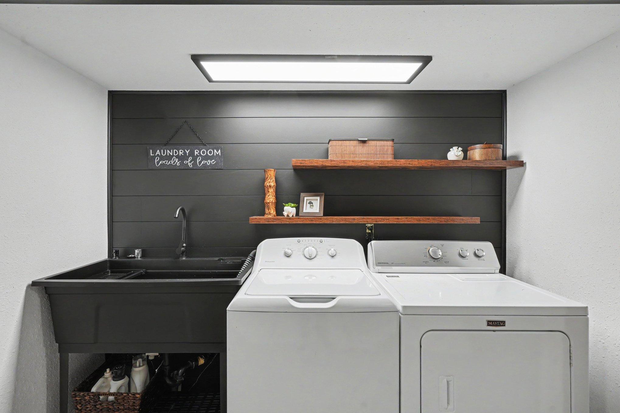 The laundry space has a built-in sink