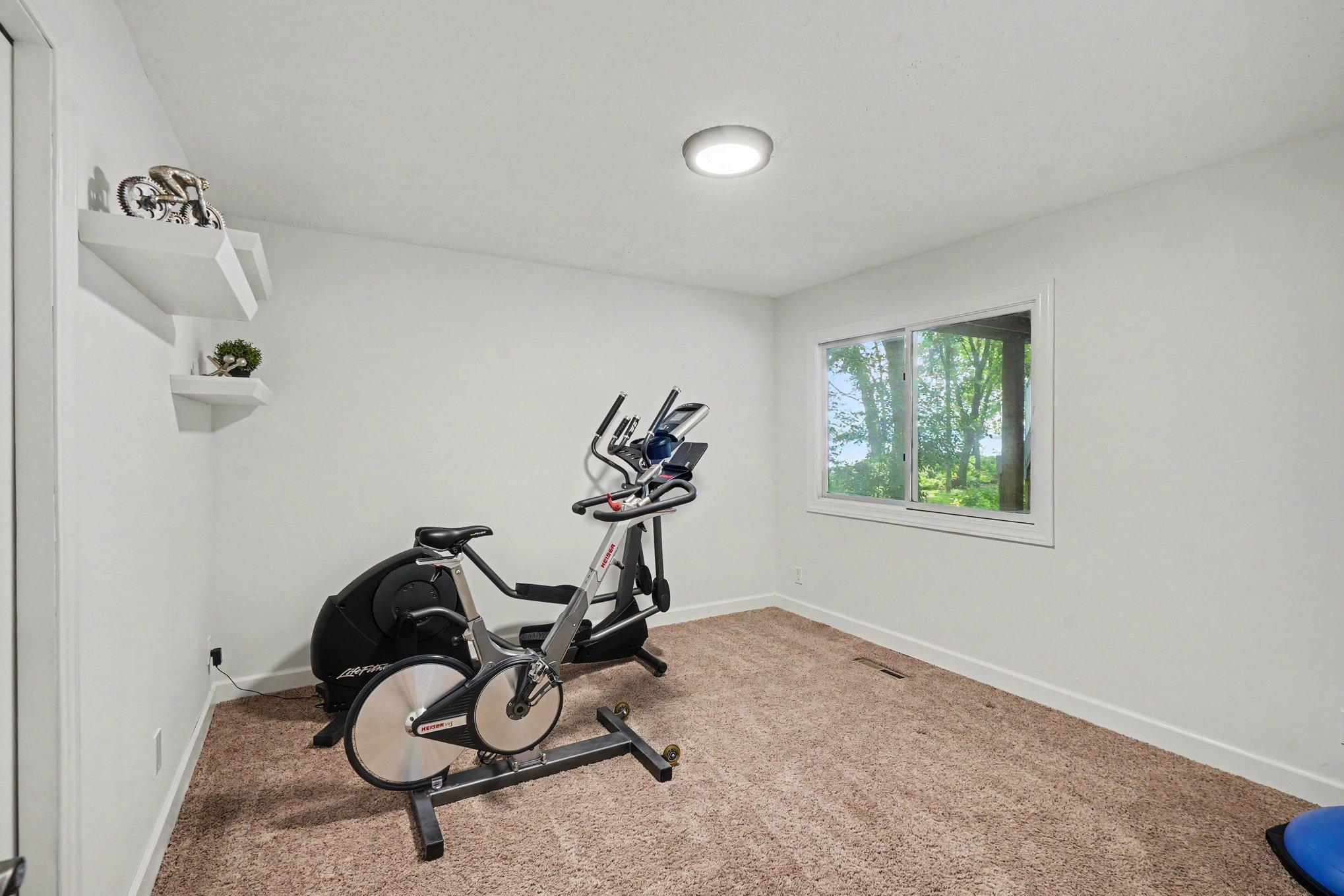 Fourth bedroom has a window with views of the lake and back yard.