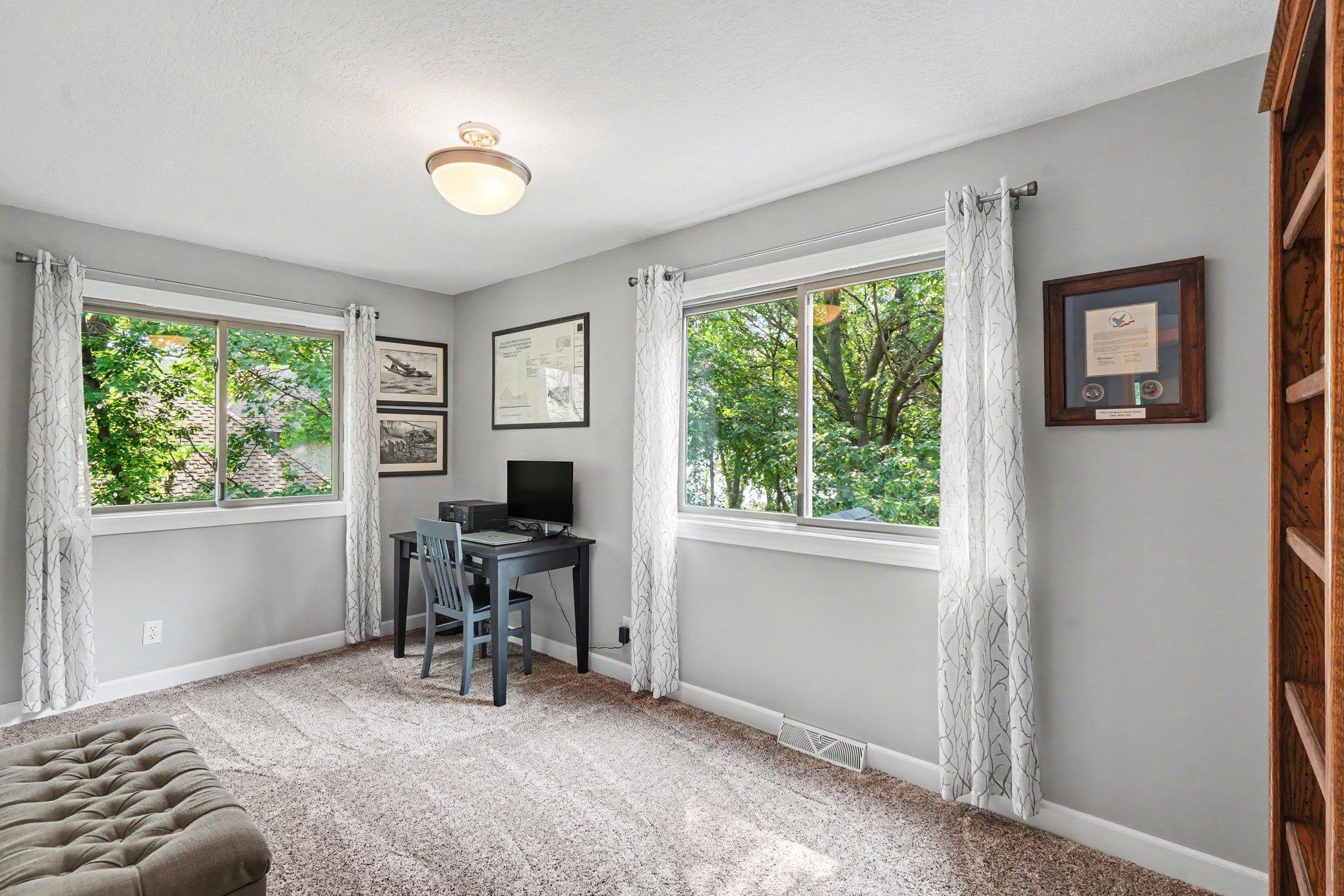 The 2nd bedroom has windows facing the back and side yard.