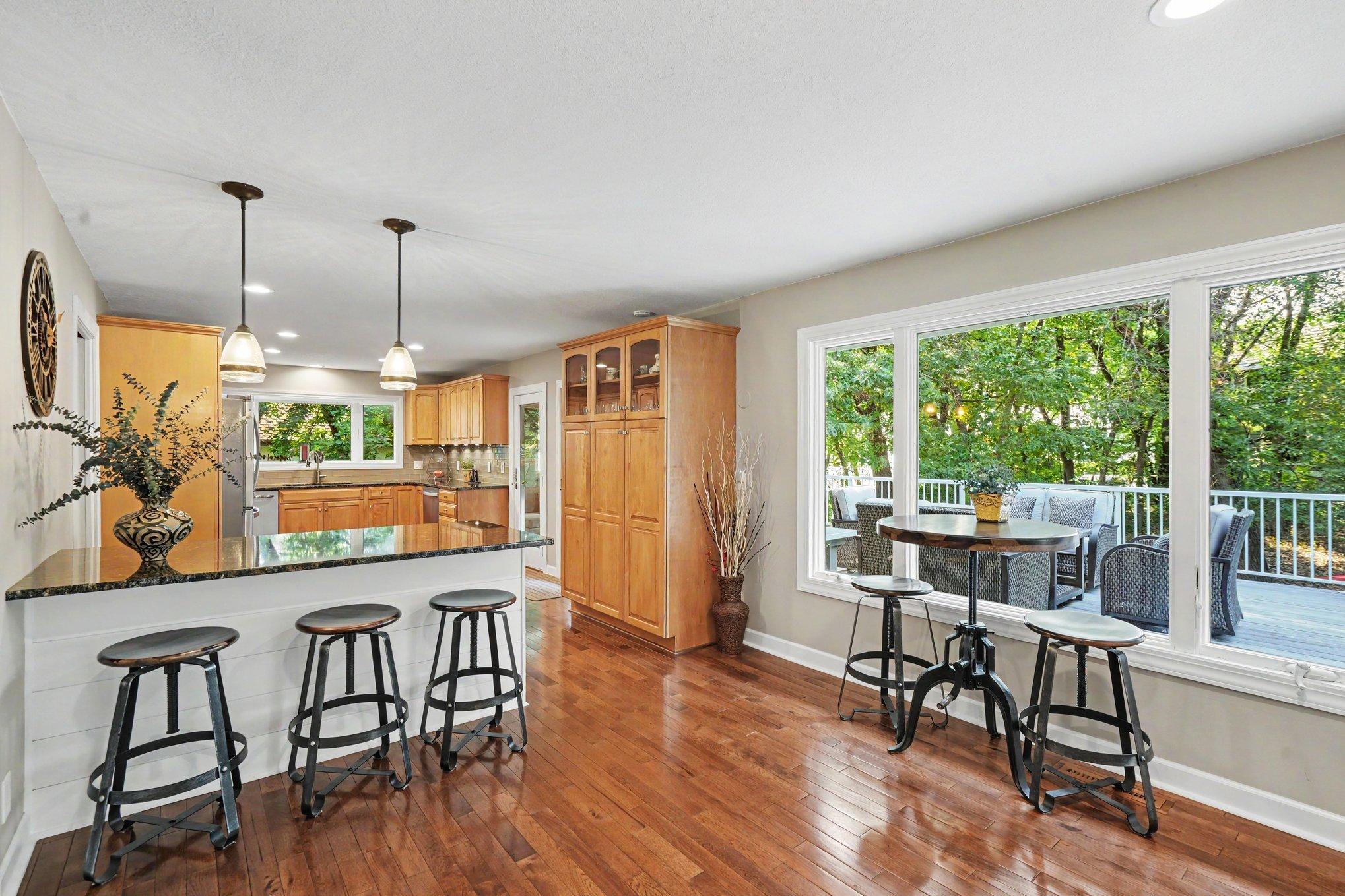 The main level boasts hardwood floors throughout the kitchen, informal and formal dining room and foyer.