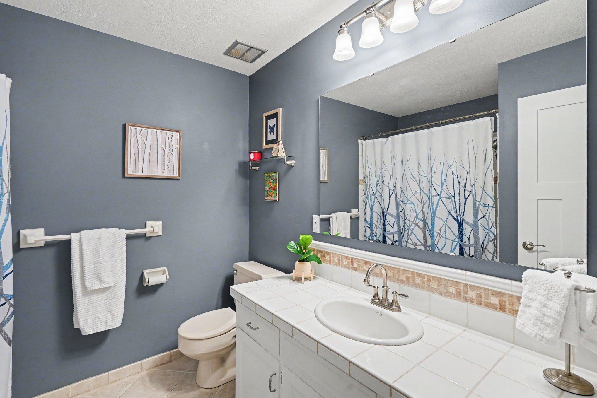 The full hall bath finishes off the upper level