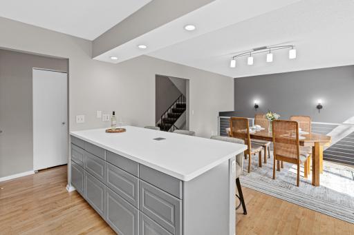 The open sightline from the breakfast bar into the kitchen makes hosting effortless, whether it's a quick weeknight meal or weekend get-together.