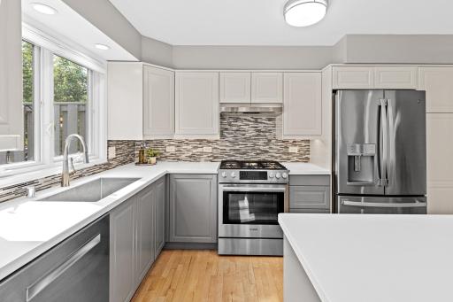 Every detail here was considered, from the mosaic tile backsplash to the sightline out to the deck, this kitchen was made for everyday living.