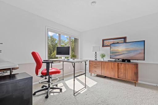 Sunlight pours across the carpet in this versatile room ready to become whatever your lifestyle calls for.