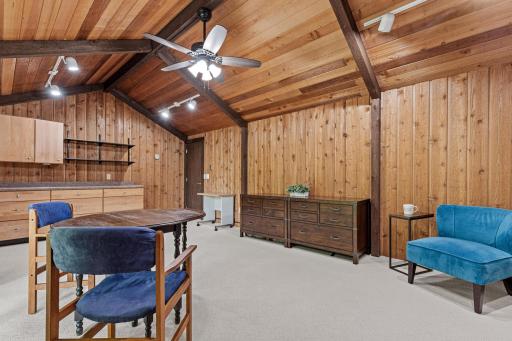 Built-in cabinetry and open shelving make this sunlit bonus room ready for a home office, craft space, or media room, the possibilities are endless.