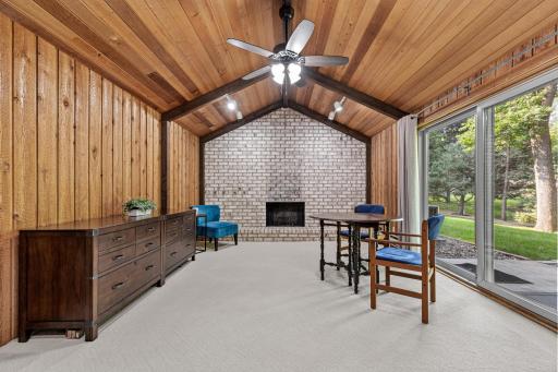 A versatile lower-level retreat awaits, wrapped in rich wood paneling and topped with a vaulted, tongue-and-groove ceiling that adds warmth and character.
