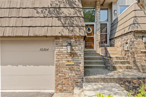Cedar shake and brick exterior details give this home striking curb appeal.
