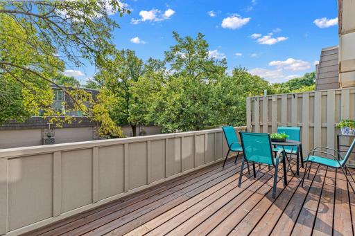 Wide plank decking and privacy panels create an elevated outdoor room ready for entertaining.