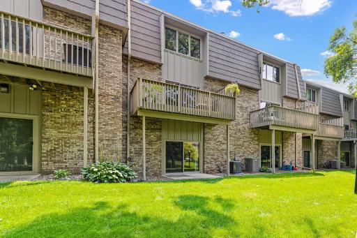 Your private balcony along the back of the home is framed by mature trees for a peaceful, elevated perch above the yard.