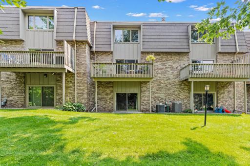 Take in the leafy, tree-shaded backdrop from your quiet deck tucked above the lush lawn below.