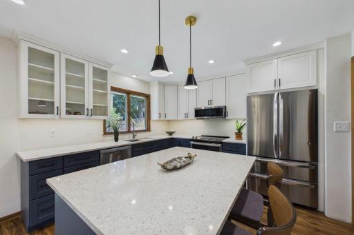 Custom designed kitchen, offers tons of storage and work space for cooking and entertaining.