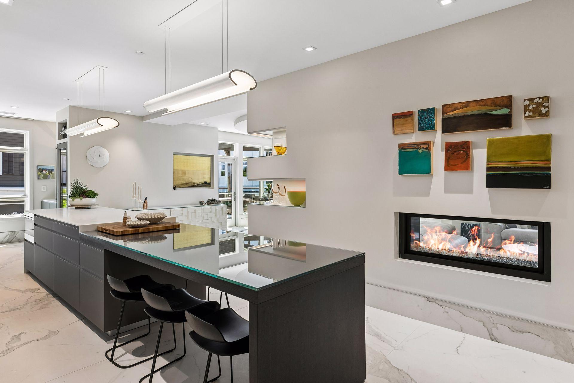 Double sided fireplace separating the dining room and living room spaces