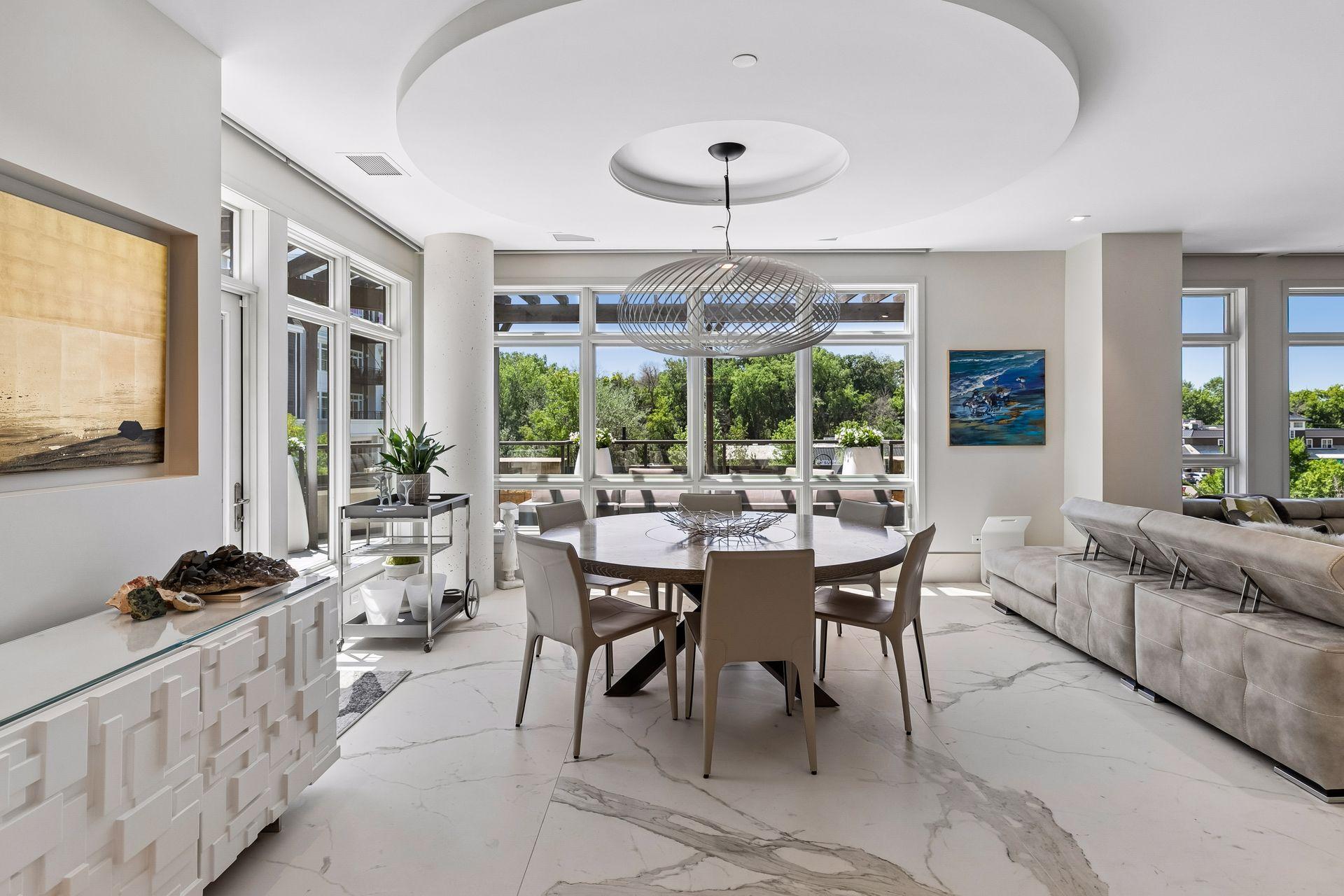 Dining room flooded with natural light and access to the deck