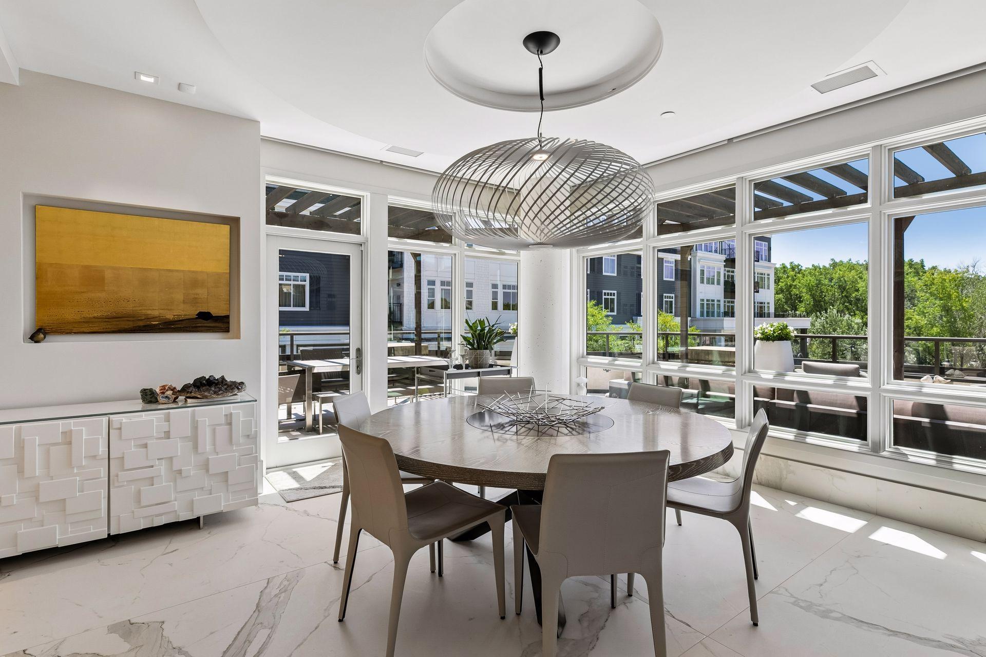 Dining room flooded with natural light and access to the deck