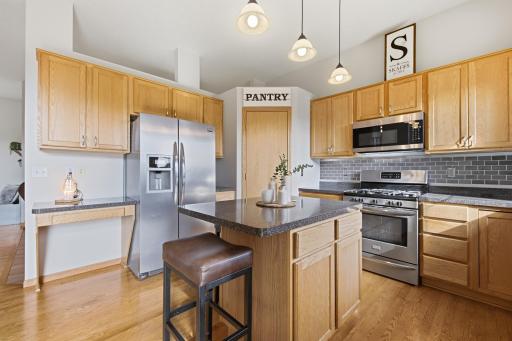 You are going to love this kitchen - plenty of room for the chef and a lot of storage with a nice corner pantry.