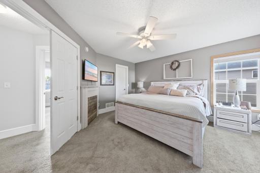 Primary suite is nice and bright and has French doors, private 3/4 bath, walk-in closet and a faux fireplace.