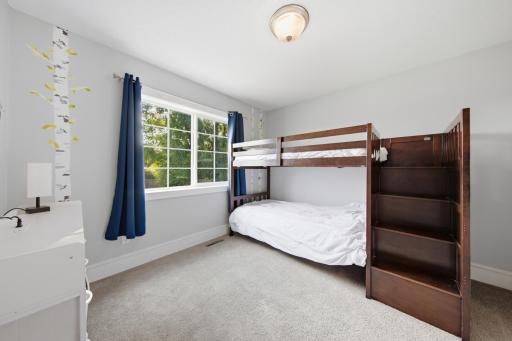 The last bed of three beds on the upper level.