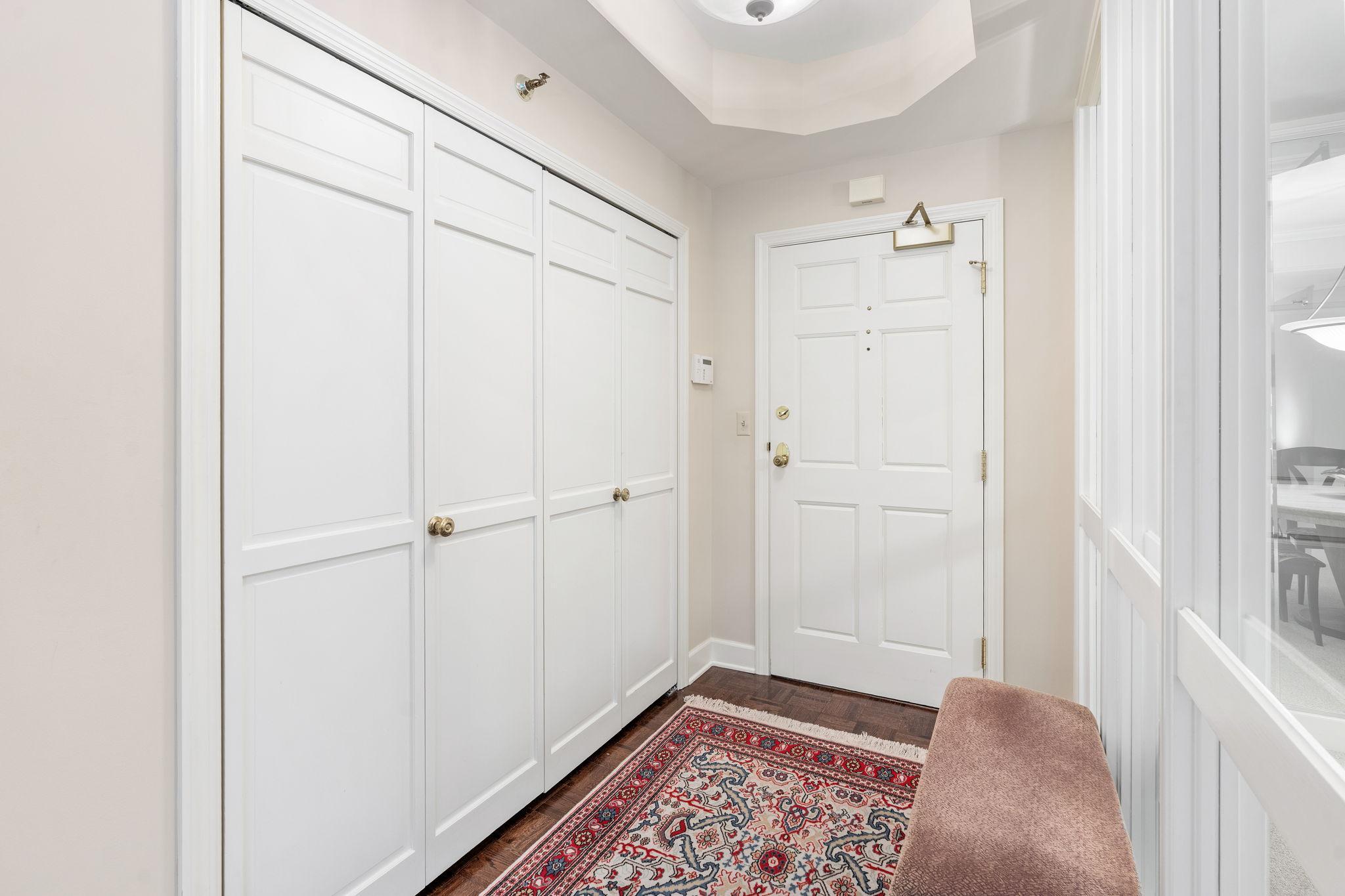 A welcoming entry foyer to unit #112 (one elevator stop up from the main floor lobby)