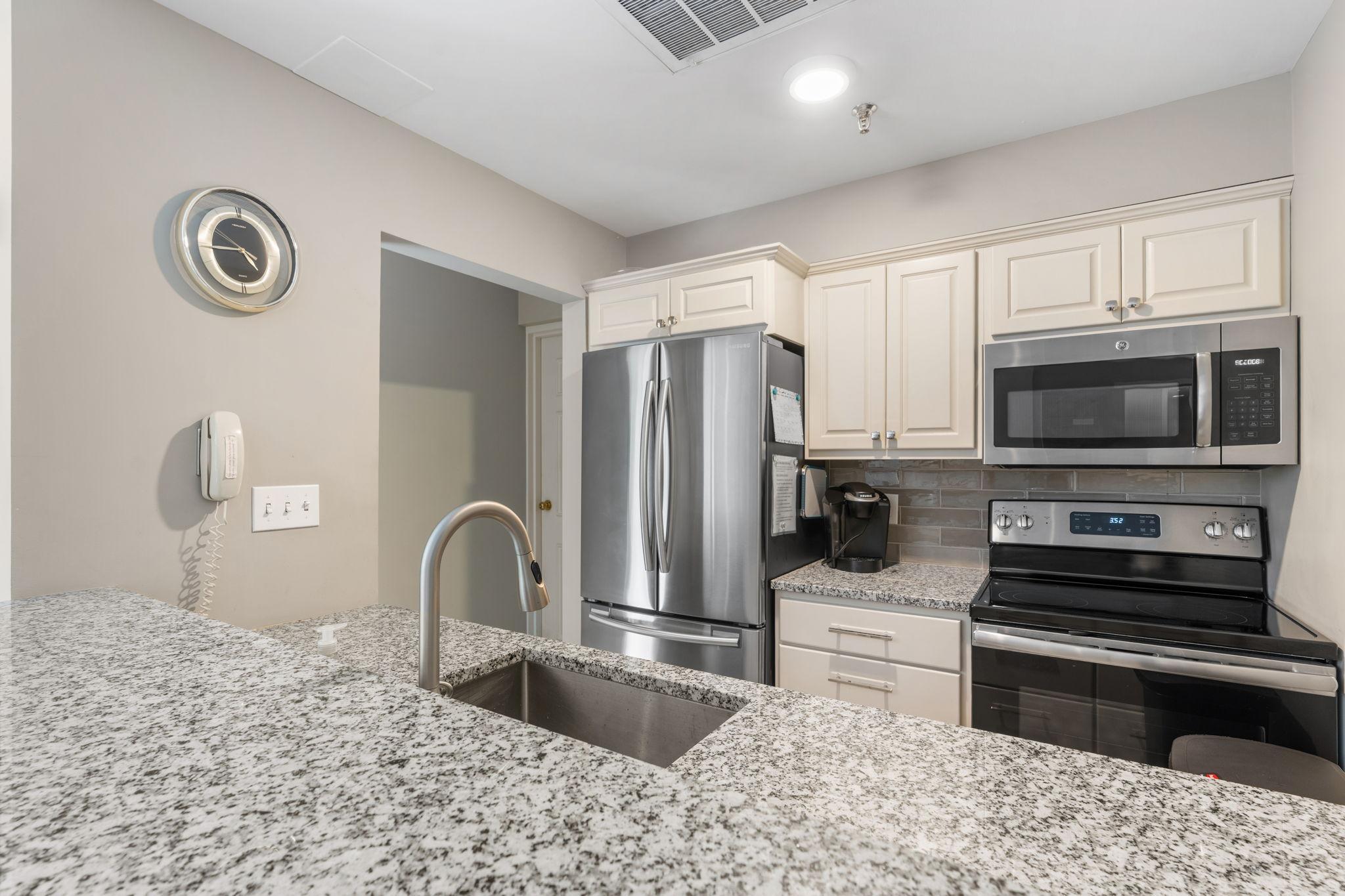 A well appointed full kitchen in the community/party room