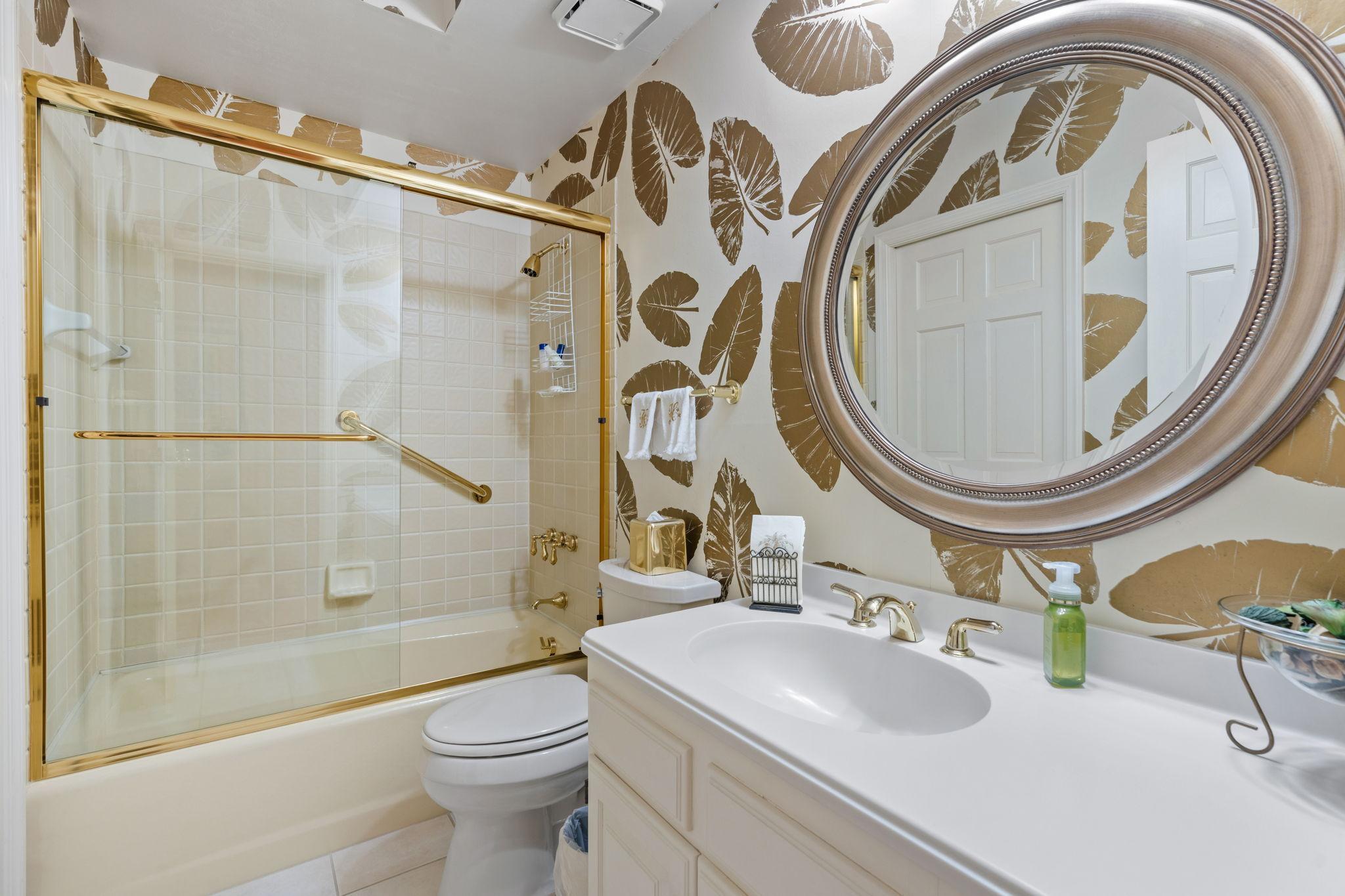 Fun, statement wallpaper in the secondary bathroom