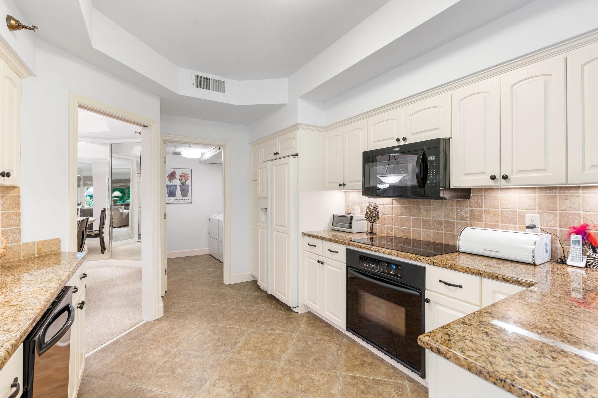 The laundry room is straight back from the kitchen