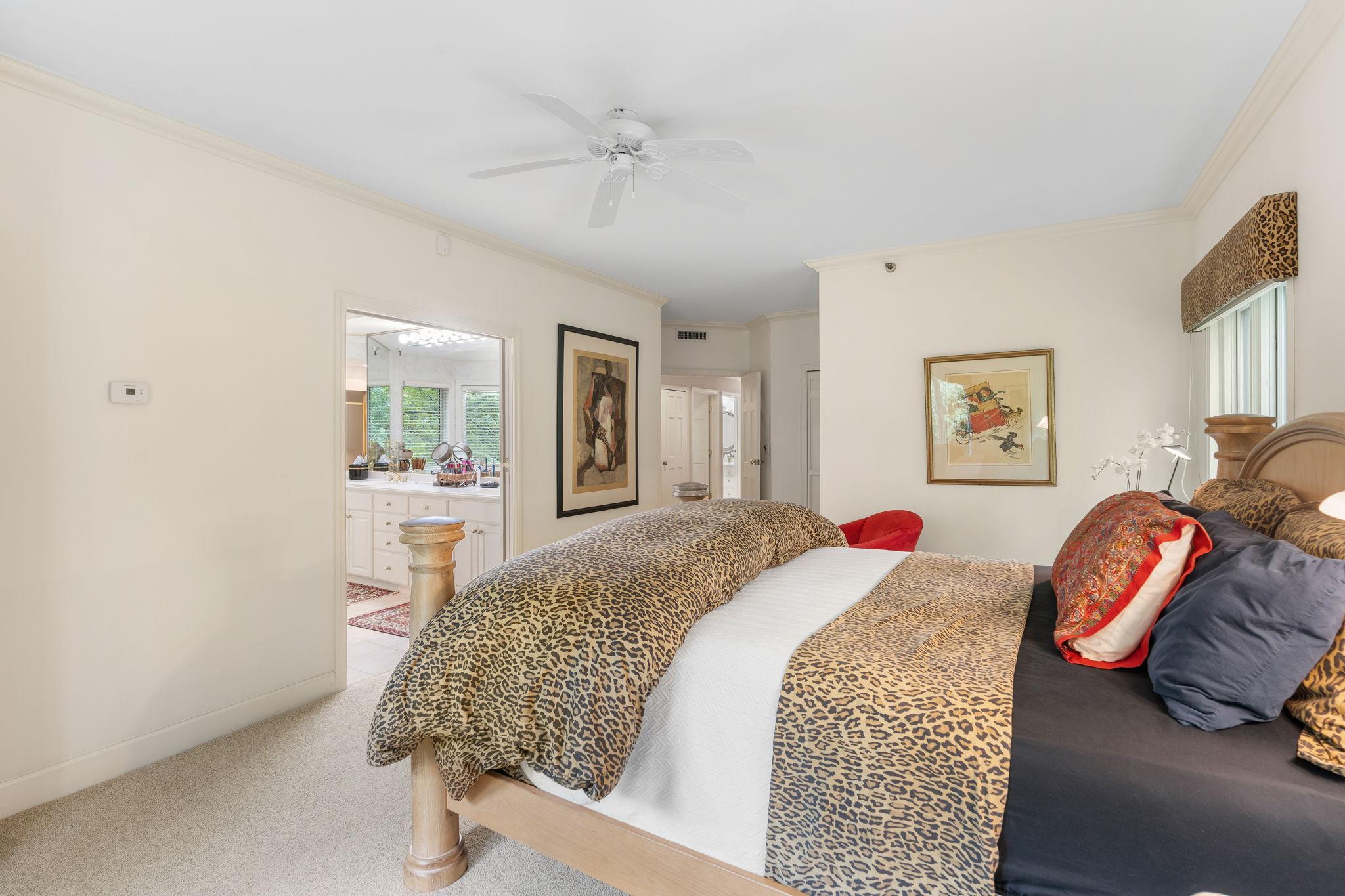 Enjoy the en suite primary bathroom through a double wide doorway