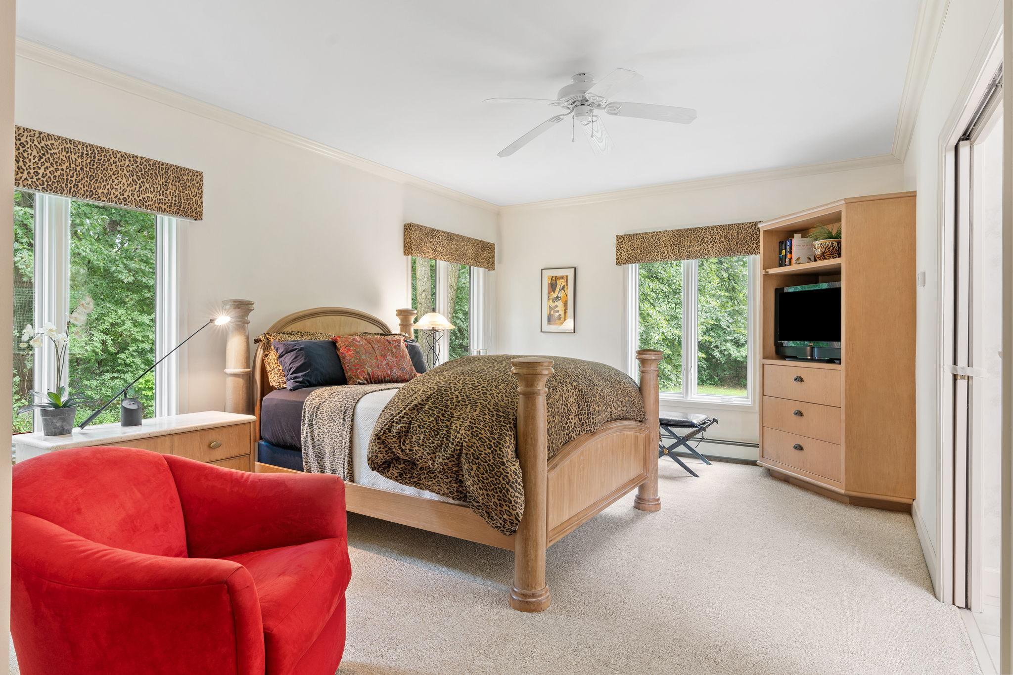 The primary suite offers wonderful space and natural lighting from 3 sets of oversized windows