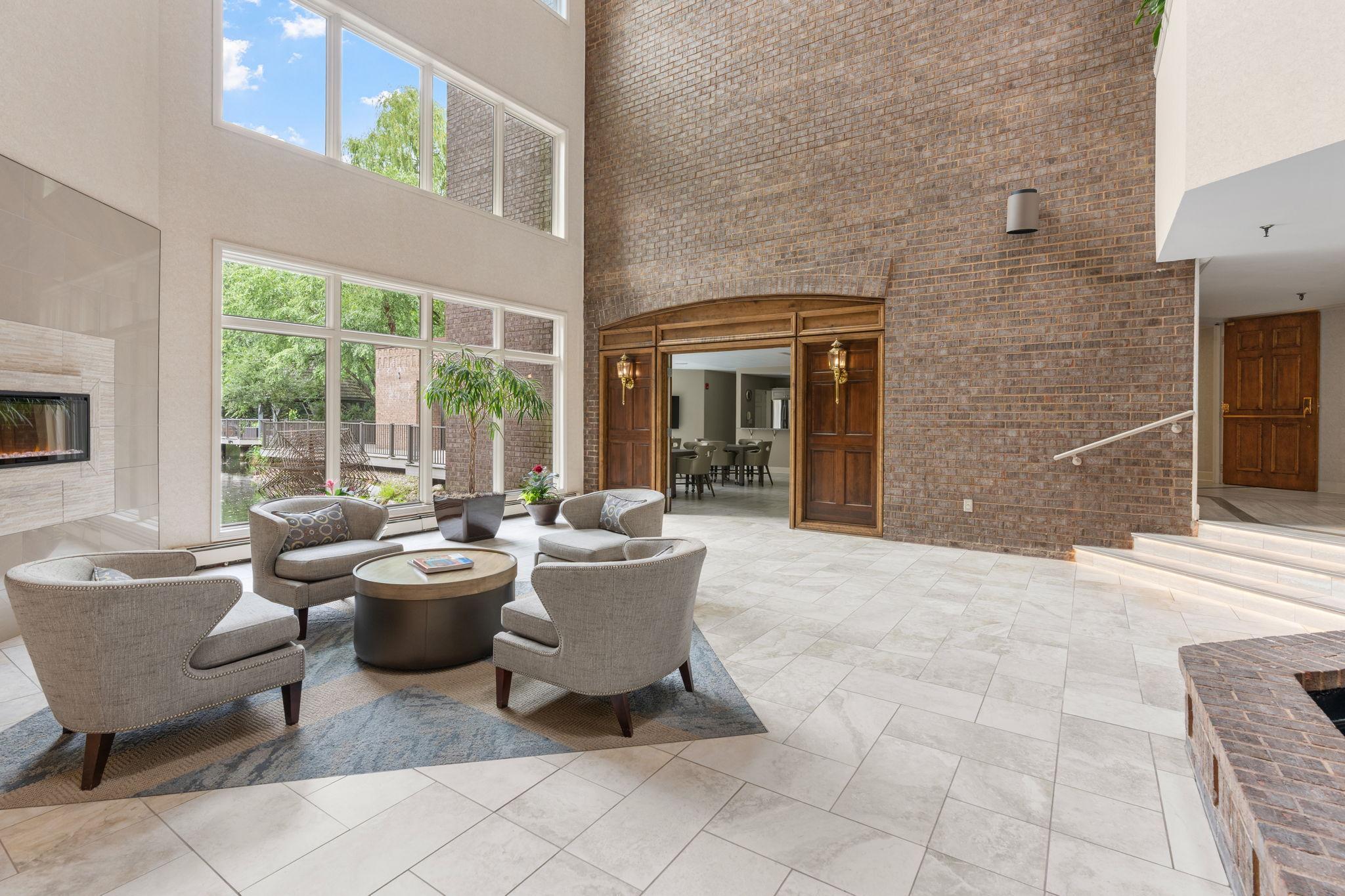 Expansive windows flood this lobby with year-round natural light