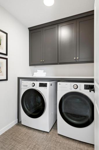 Upstairs laundry room . *Photos are of like home and may not depict actual home plan. Configurations, features, materials and finishes may contain options that are not included in the price.