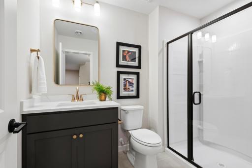 Lower level 3/4 bath. *Photos are of like home and may not depict actual home plan. Configurations, features, materials and finishes may contain options that are not included in the price.