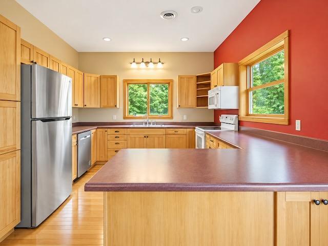 Bright Rustic Kitchen with Red Accent Wall