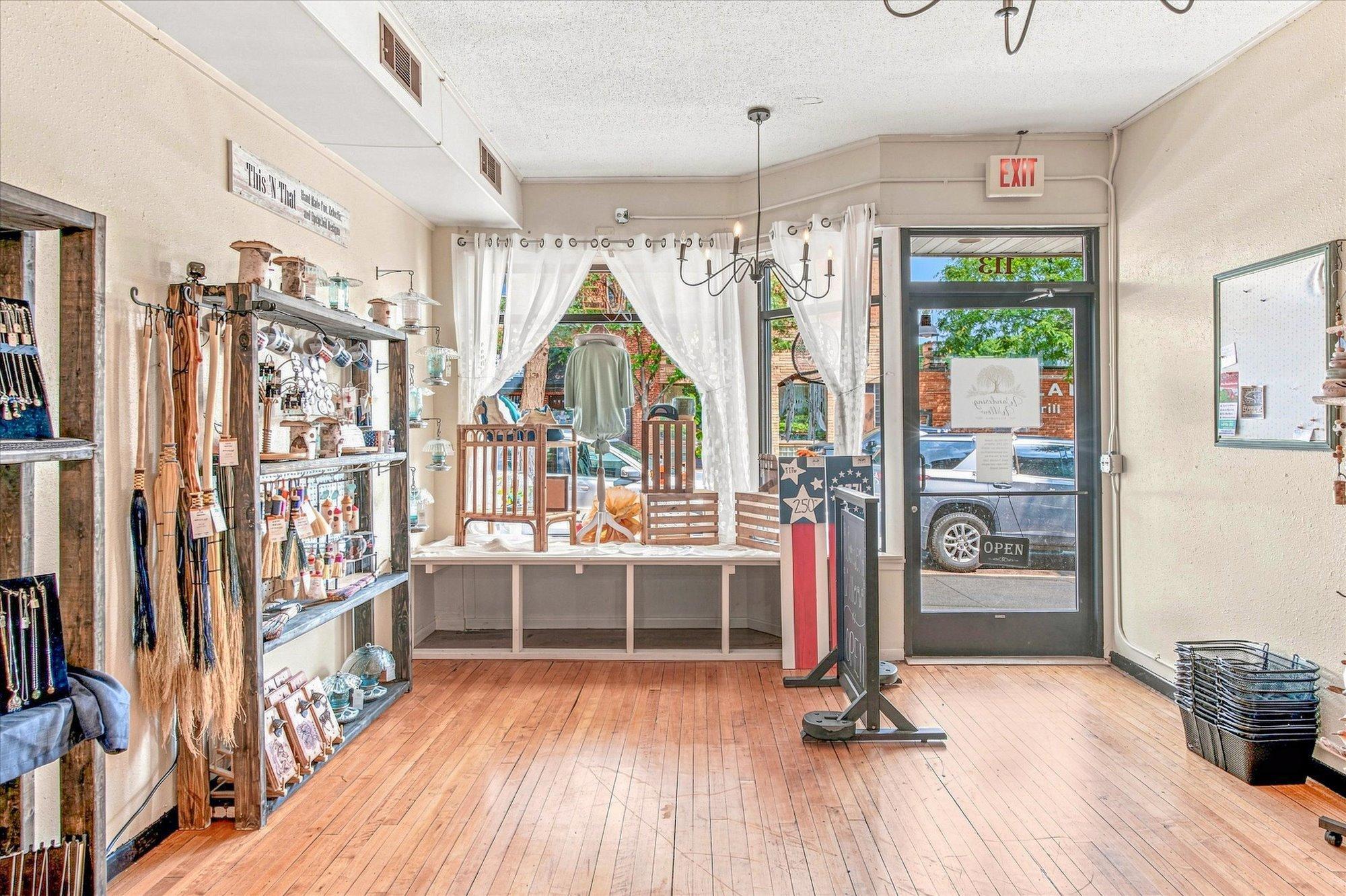 113 Front entrance features hardwood floors, large front window display area.