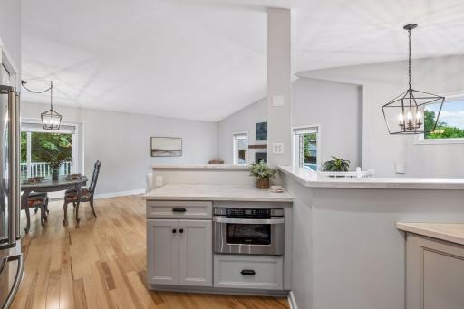 Built-in Microwave cabinet with a pullout drawer beneath the kitchen island.