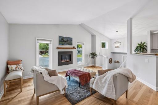 Open living floor plan gives this home a spacious feeling. Gas fireplace with floor to ceiling windows provide plenty of natural light.