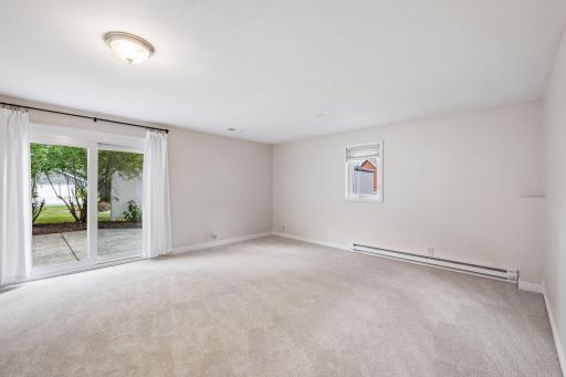 Lower level walkout family room with new carpet throughout and supplemental heat.