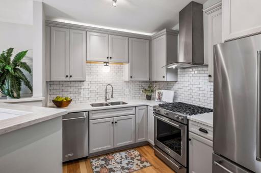 Appreciate the white subway backsplash and newer counter tops.