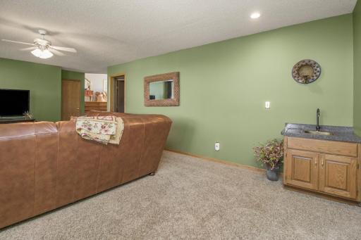 LARGE family w corner wet bar.