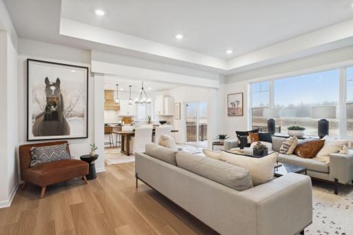 This home defines open concept living! With the family room opening up to the kitchen and dinning rooms. Note all the large windows for an abundance of natural light.
