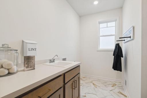 A main level laundry is often a must have, this home offers this large laundry room conveniently located on the main floor.