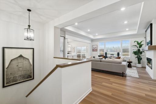 The entry flows into the great room and to the spacious stairway leading to the finished lower level.