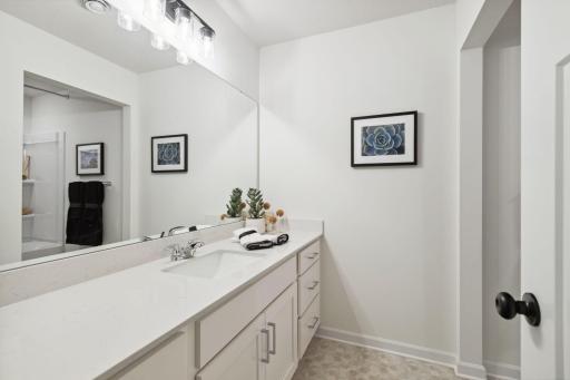 The lower level bath is stunning and spacious! It is ideal for servicing the lower level rec room and two lower level bedrooms.