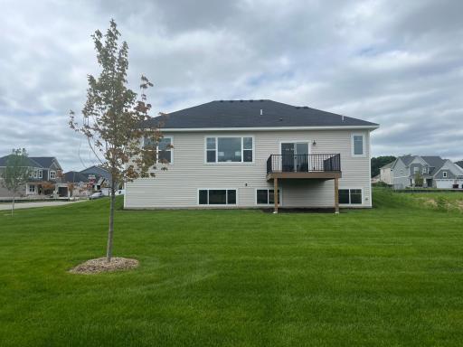 The back yard is perfect in size, plenty of green space to enjoy but not a huge commitment to maintain. Grill and entertain on your new deck as well.