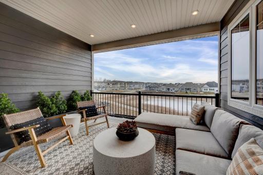 Take the party outside or find a quiet afternoon for some outdoor living! This home features this secluded covered veranda. (model photo)