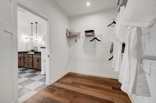 Without the space to stay organized it can be challenging but with the owner's walk in closet you will finally have all the space you need. (model photo)